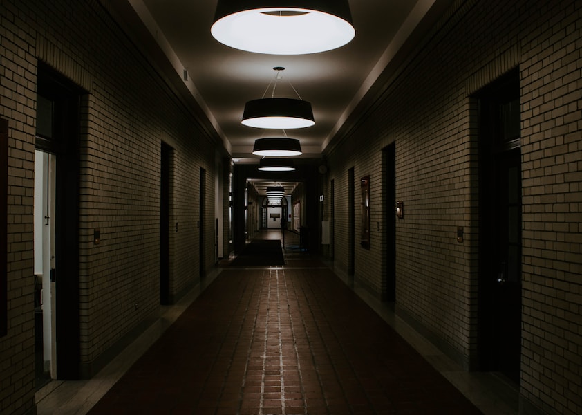 empty and lighted hallway of building